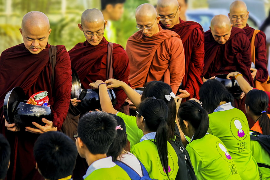 Buddhist Monks Receiving Alms from Laypeople