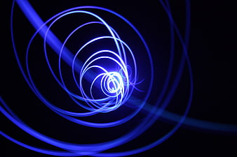 Abstract Blue Light Spiral on Black Background
