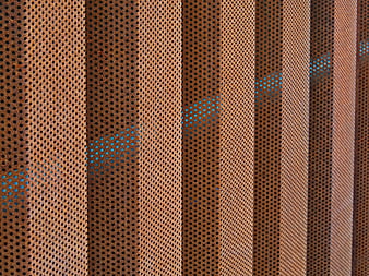 Abstract Perforated Metal Wall Texture with Blue Light