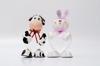 Cute Cow and Bunny Easter Candy Jars on White Background