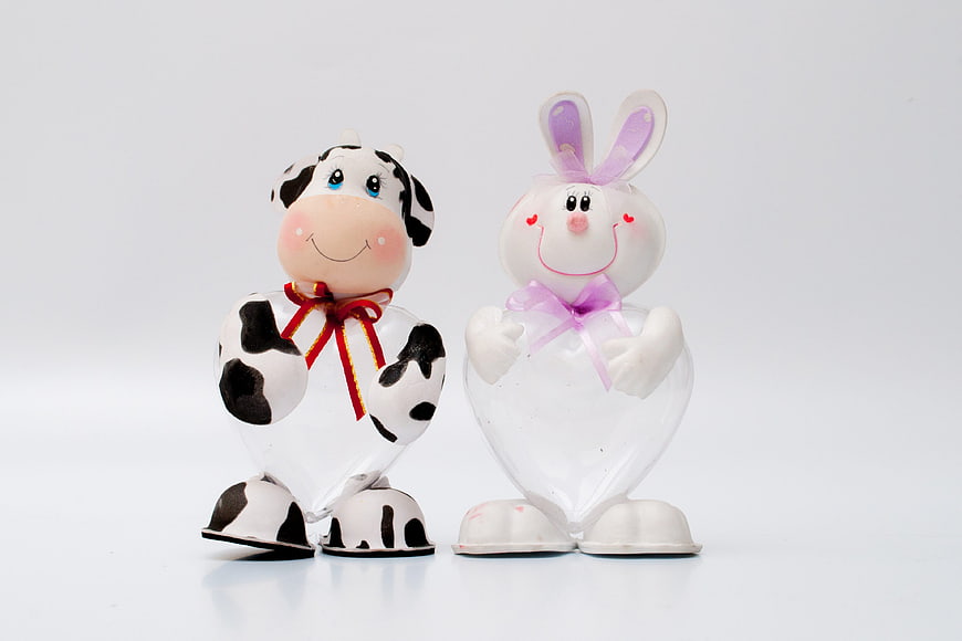 Cute Cow and Bunny Easter Candy Jars on White Background