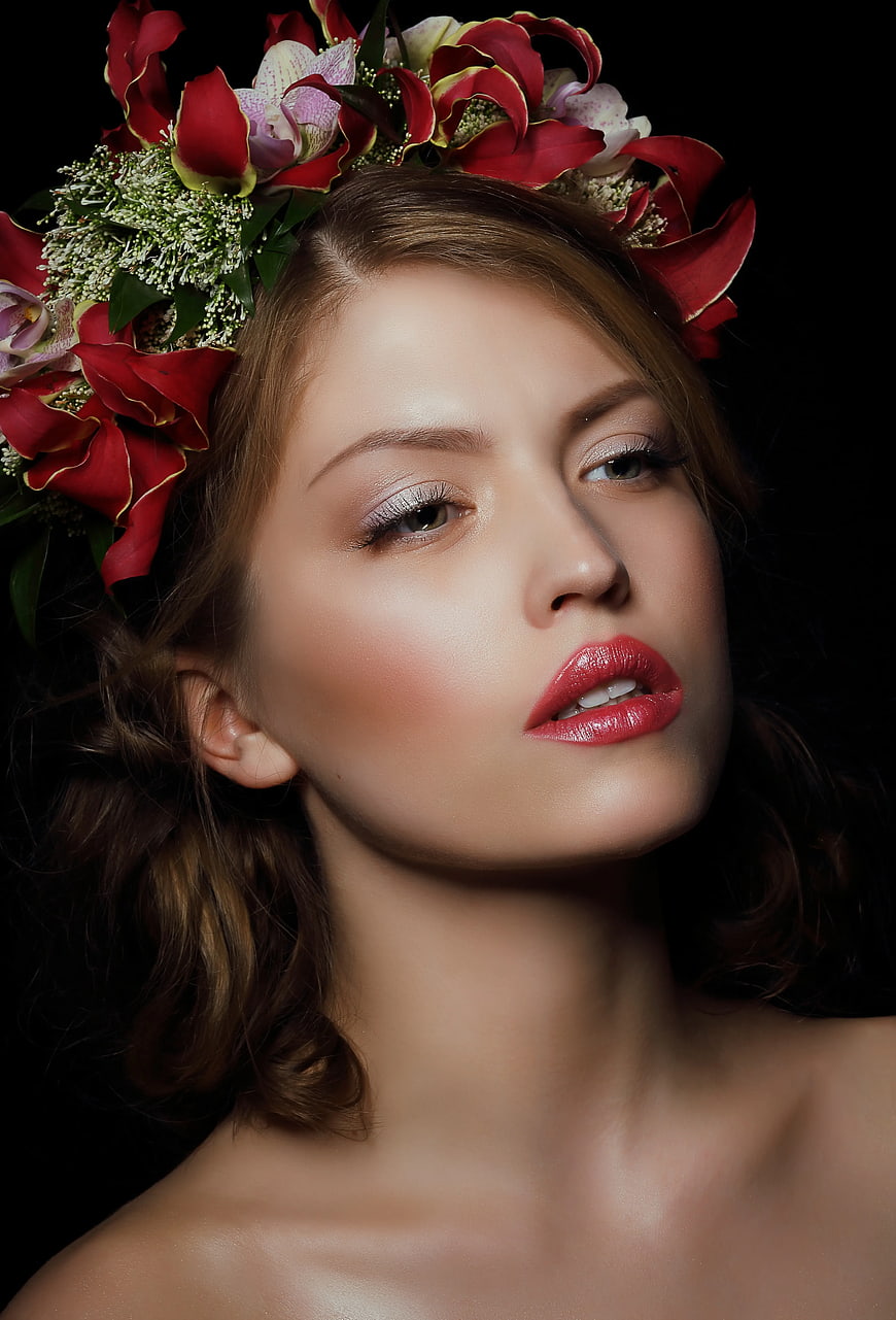 Woman with Red Floral Crown and Glossy Lips