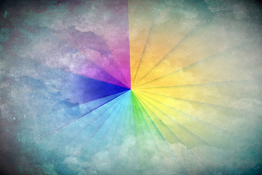 Abstract Rainbow Color Wheel Radiating on Textured Cloud Background