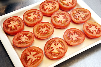 Sliced Tomatoes Arranged On White Ceramic Plate