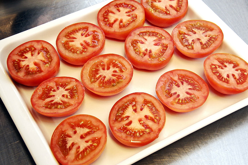 Sliced Tomatoes Arranged On White Ceramic Plate