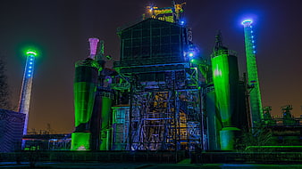 Illuminated Industrial Blast Furnace At Night In Duisburg Germany
