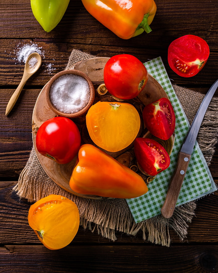 Fresh Bell Peppers and Tomatoes on Wooden Board