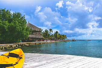 Yellow Kayak on Wooden Dock Tropical Beach Resort