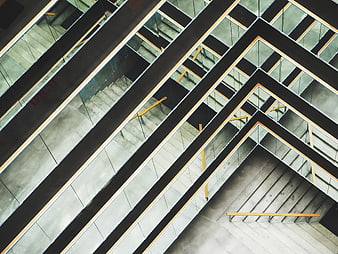 Abstract geometric modern architecture with concrete stairs and glass railings