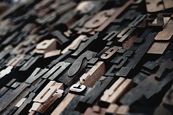 Close-up of vintage wooden printing press letters and numbers