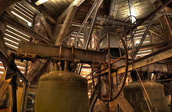 Old church bells inside wooden bell tower structure