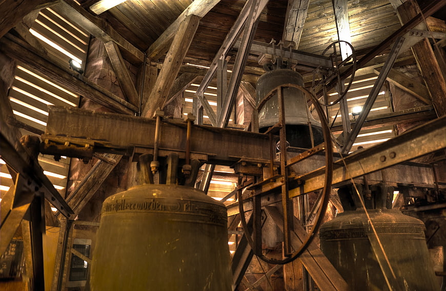 Old church bells inside wooden bell tower structure