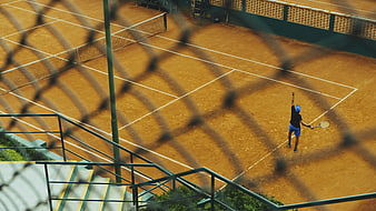 High angle view of tennis player serving on clay court