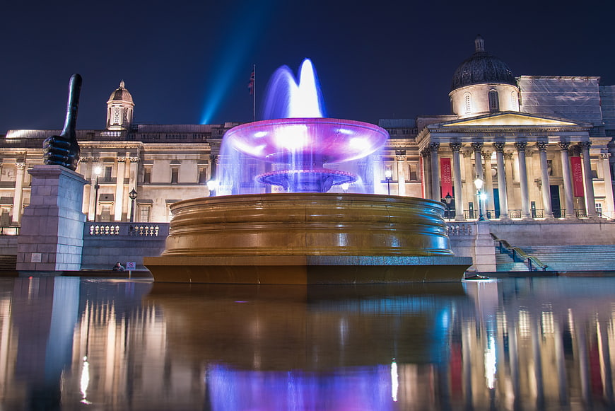 Trafalgar Square Fountain at Night with Illuminated Water