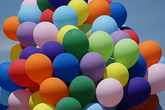 Colorful Balloon Bouquet Against Blue Sky