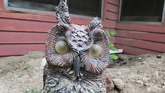 Weathered Garden Owl Statue with Large Yellow Eyes