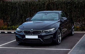 Black BMW M4 Coupe Parked in Parking Lot