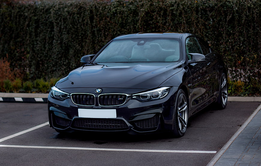 Black BMW M4 Coupe Parked in Parking Lot