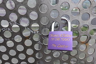 Purple Love Lock with Names and Date on Metal Grating