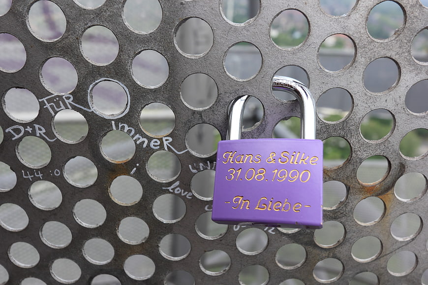 Purple Love Lock with Names and Date on Metal Grating