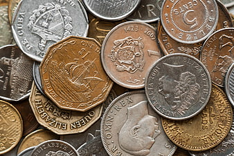 Close-up of assorted international coins and currency