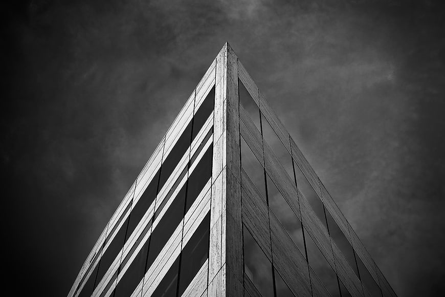 Black and white low angle view of modern skyscraper corner