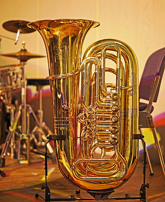 Golden Tuba On Stage With Drums In Background