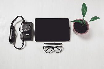 Minimalist Workspace Flat Lay with Camera and Laptop