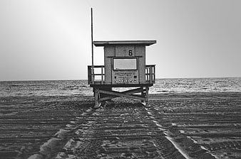 Solitary Lifeguard Tower on Sandy Beach
