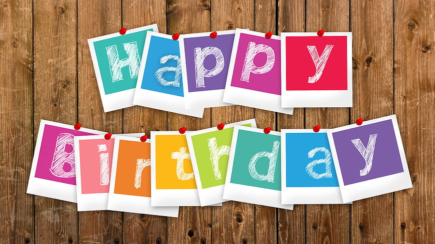 Happy Birthday Polaroid Photos on Wooden Background