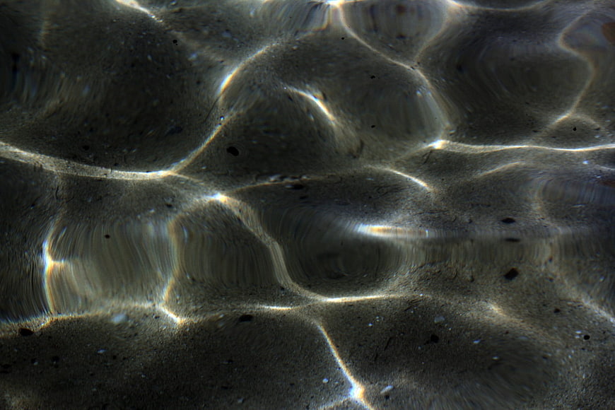 Abstract Underwater Sand Texture With Caustic Light Patterns