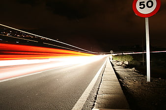Night Highway Long Exposure With Speed Limit Sign
