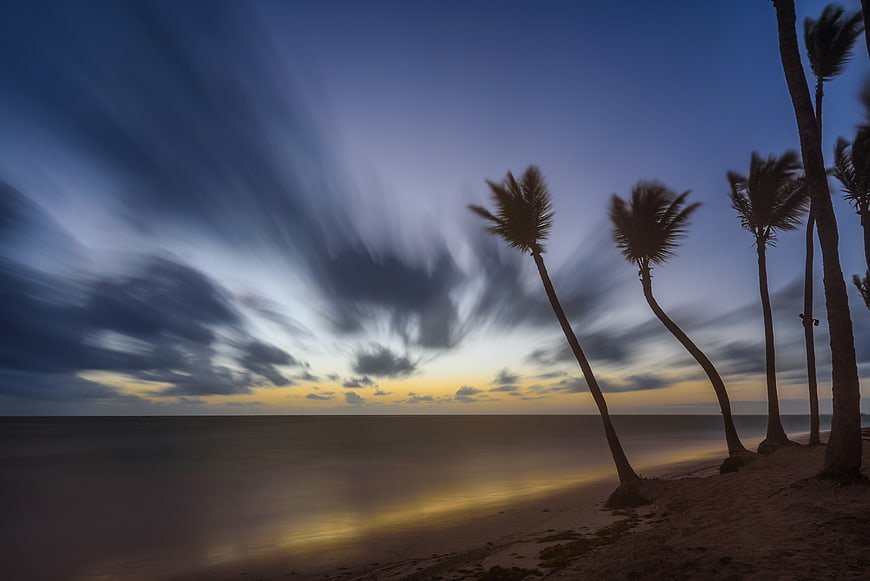 Long Exposure Sunset with Silhouetted Palm Trees on Beach