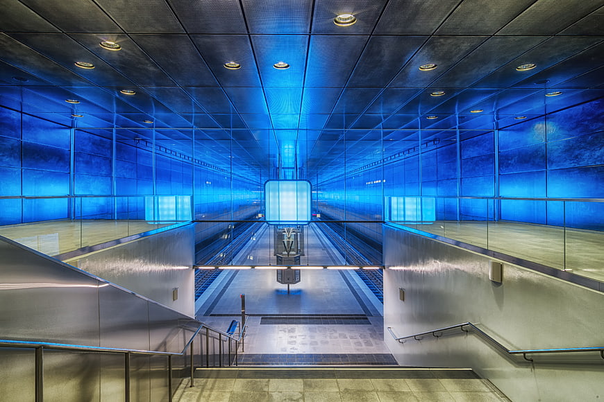 Modern Blue Lit Subway Station Interior With Symmetrical Architecture