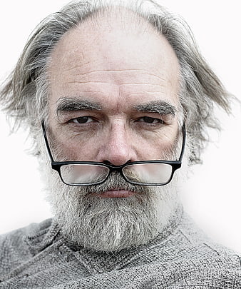 Close-up portrait of elderly bearded man with glasses