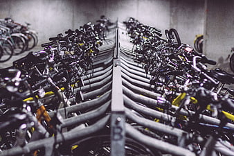 Rows of bicycles in a parking garage rack
