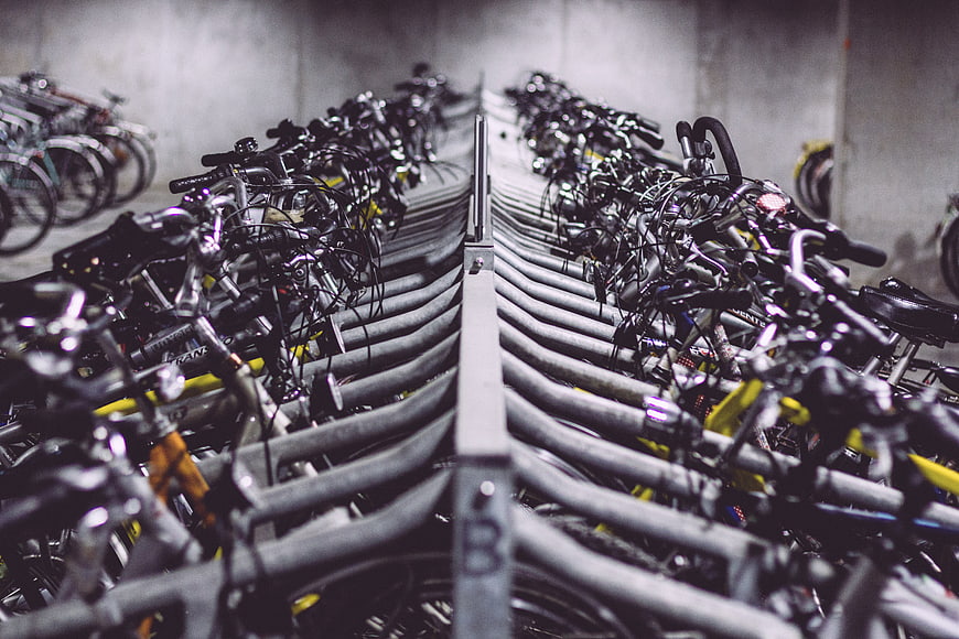 Rows of bicycles in a parking garage rack