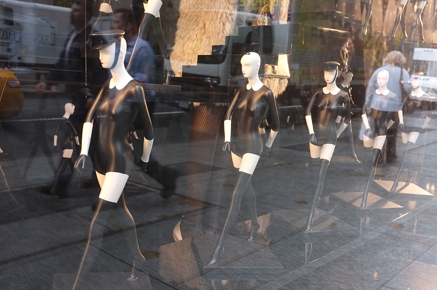 Fashion Mannequins in Shop Window with Street Reflections