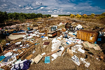 Abandoned Rural Site With Scattered Trash And Broken Furniture