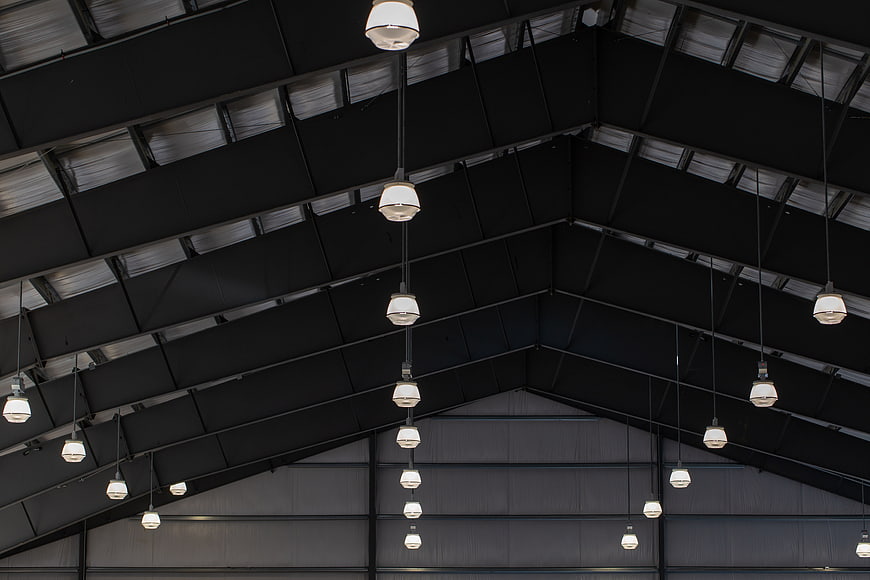 Industrial warehouse ceiling with hanging pendant lights