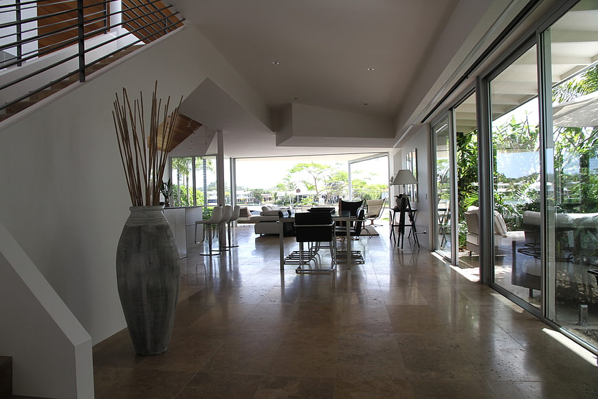 Modern luxury interior with glass walls and stone flooring