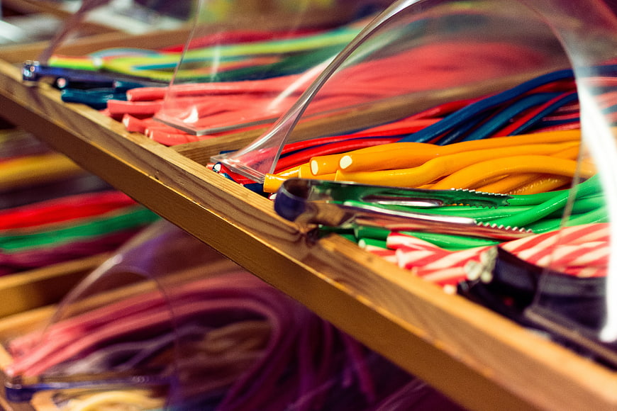 Colorful candy sticks in wooden display box