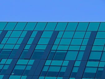 Modern Blue Glass Building Facade with Geometric Pattern