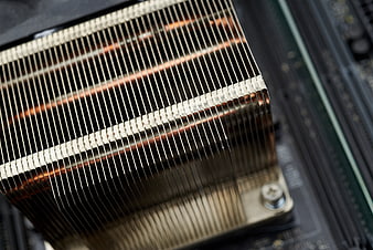 Close-up of copper CPU heat sink on motherboard