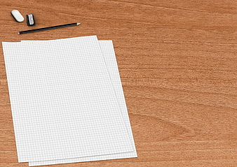 Blank Graph Paper Sheets on Wooden Desk with Pencil and Stationery