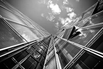 Low angle black and white modern glass skyscraper architecture