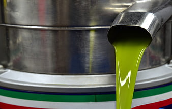 Fresh Green Olive Oil Pouring From Industrial Centrifuge
