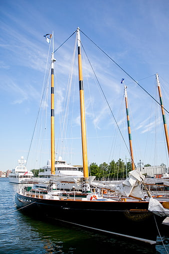 Classic Wooden Sailboats Docked in Harbor