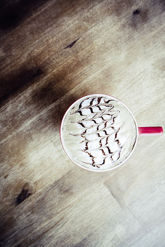 Top View Cappuccino with Latte Art on Wooden Table