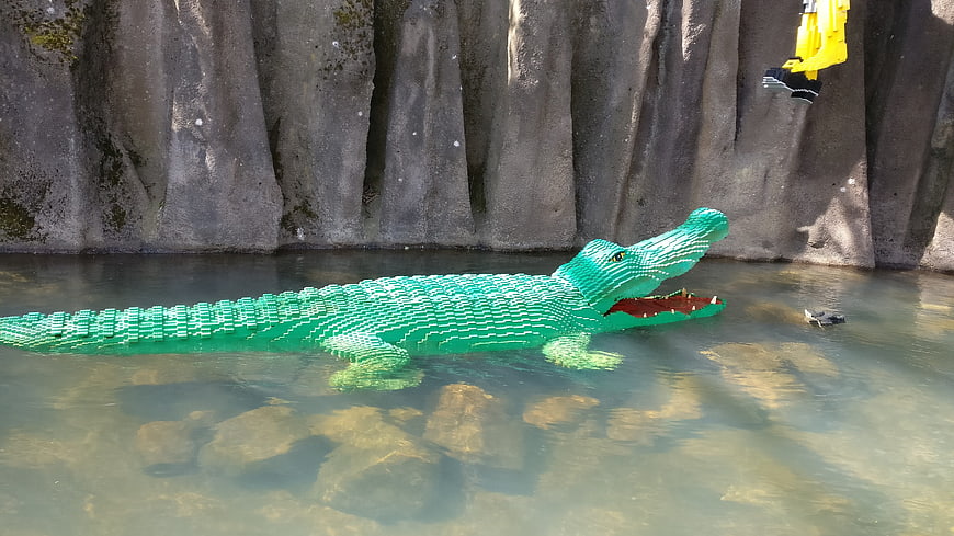 Green Lego Crocodile Sculpture Floating in Water